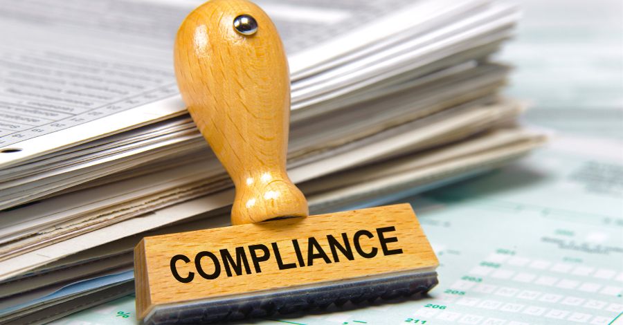 Compliance rubber stamper