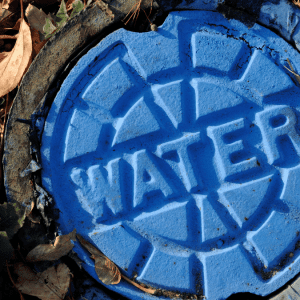 manhole cover with WATER on it